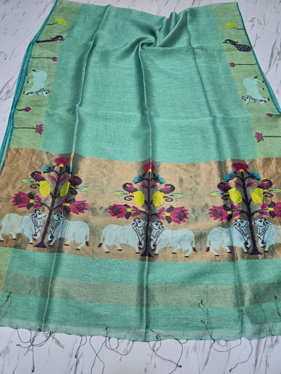 Suravi Silk Linen Pichwai Inspired Jamdani Saree by Rihyaaz featuring intricate handwoven Pichwai-inspired motifs on premium silk linen fabric, ideal for festive, wedding, and ethnic wear.