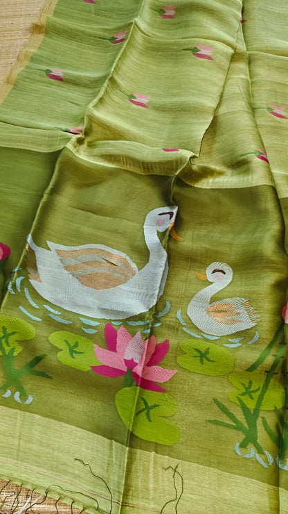 Morali olive pure silk Jayshree linen saree with sleek zari border, handwoven Jamdani resham palla and delicate lotus motifs all over the body, with running blouse piece by Rihyaaz Fashions.