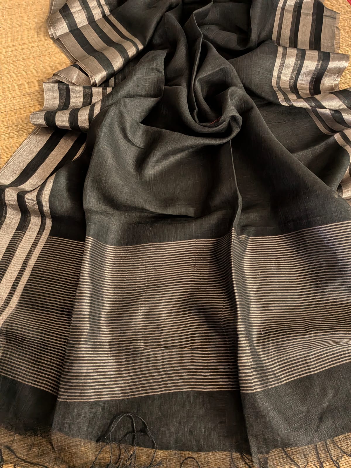 Black Pure 100-count Jayashree linen saree with tested zari double border on both sides and zari palla, including running blouse piece from Rihyaaz Fashions.