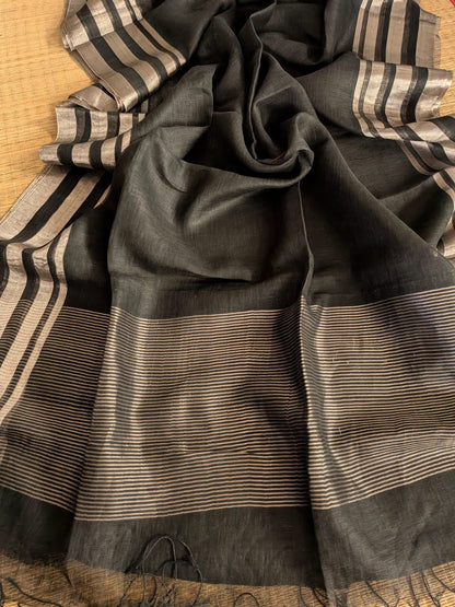 Black Pure 100-count Jayashree linen saree with tested zari double border on both sides and zari palla, including running blouse piece from Rihyaaz Fashions.