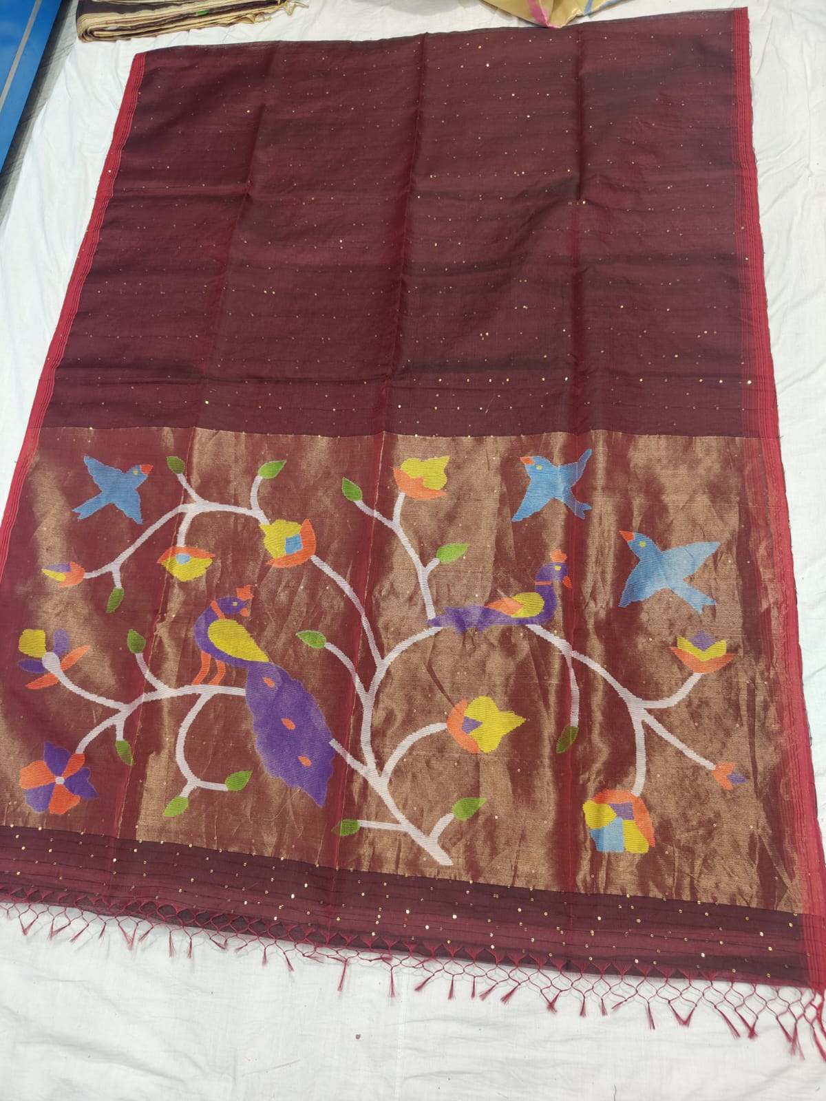 𝓞𝓭𝓱𝓪𝓷𝓲 – Muslin Silk Pathani Weave Saree with All-Over Sequin Elegance