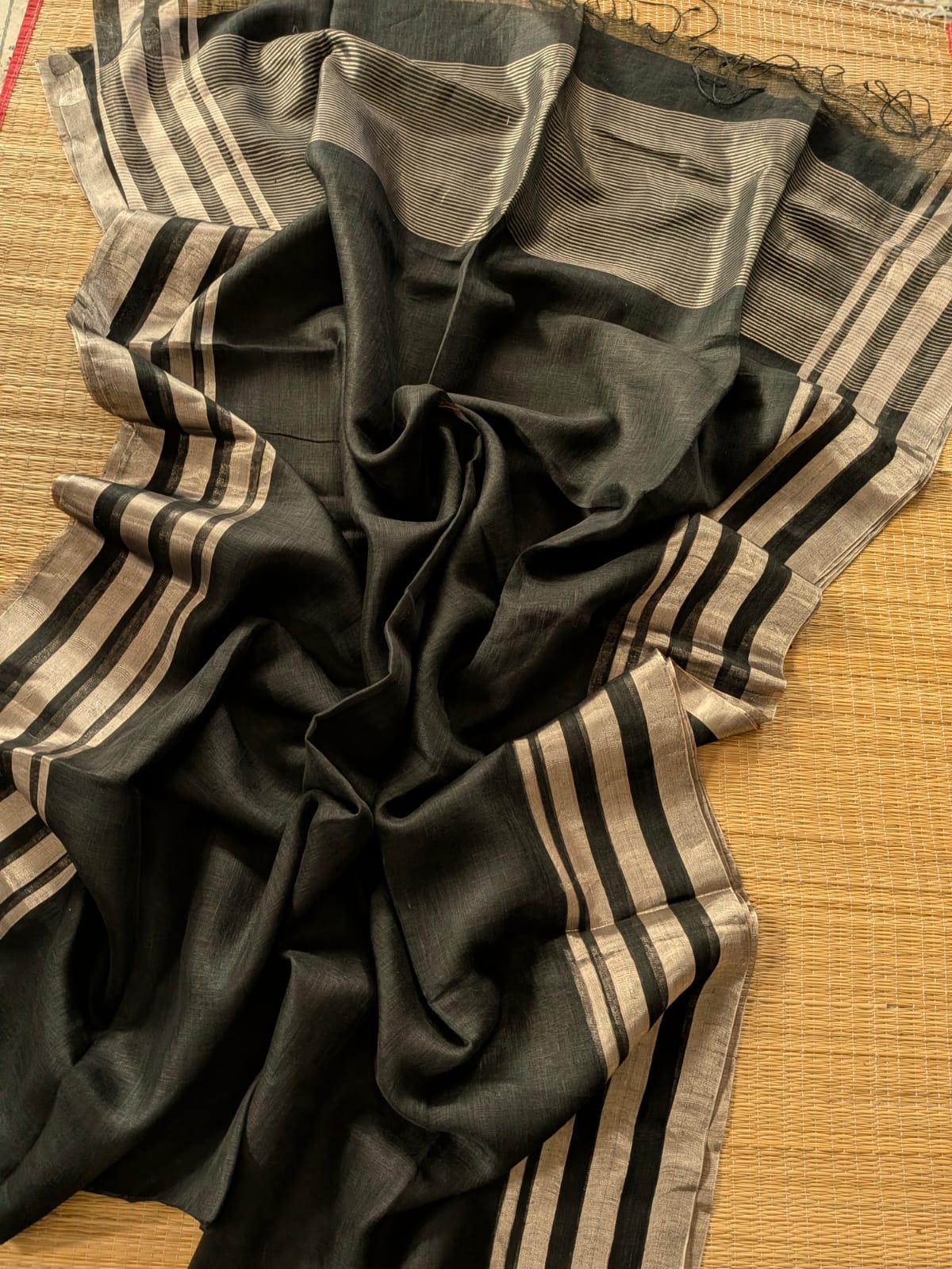 Black Pure 100-count Jayashree linen saree with tested zari double border on both sides and zari palla, including running blouse piece from Rihyaaz Fashions.