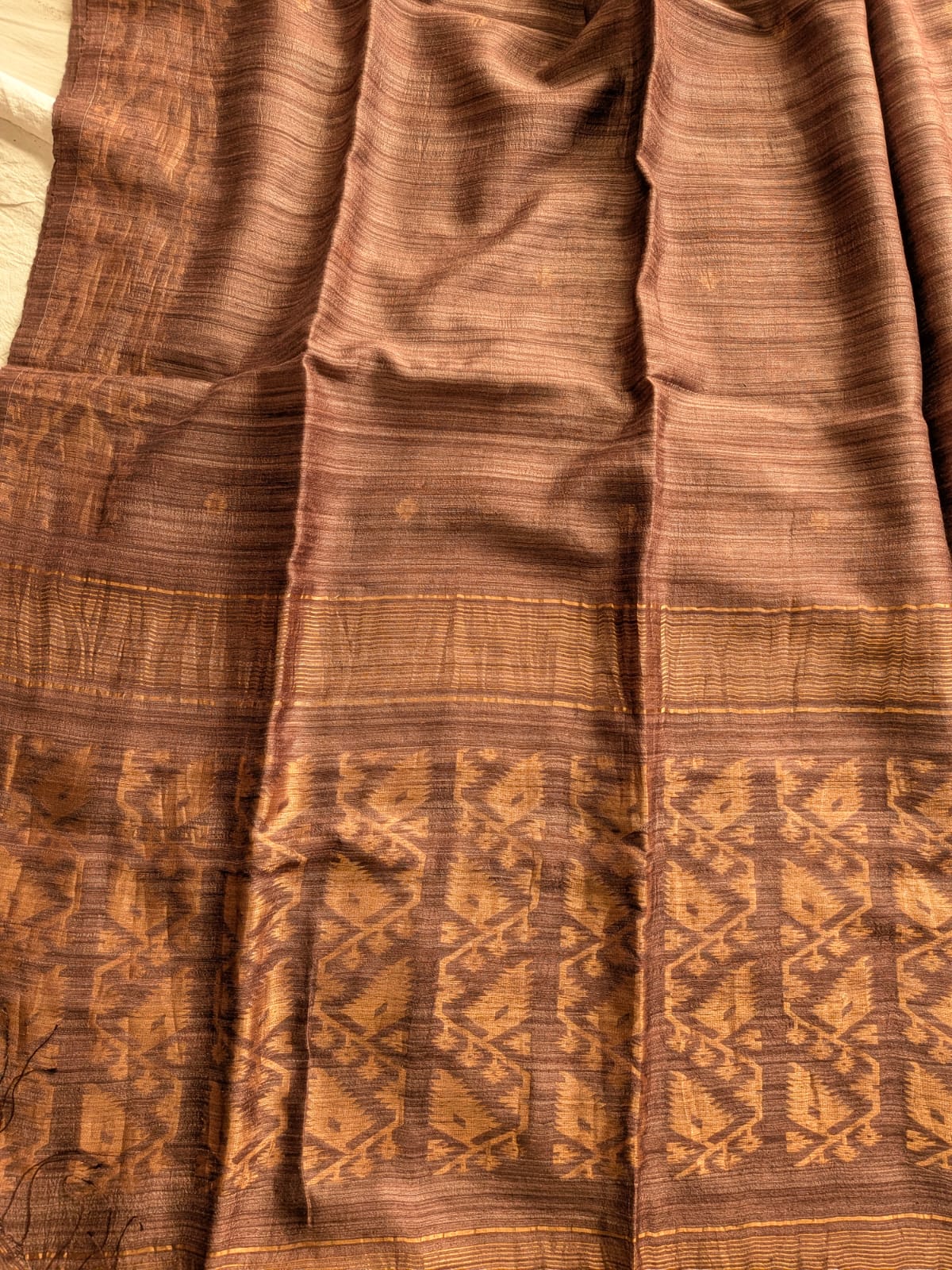 Durga Brown premium-quality Pure Matka Jamdani saree with traditional woven designs and running Matka blouse piece by Rihyaaz Fashions.