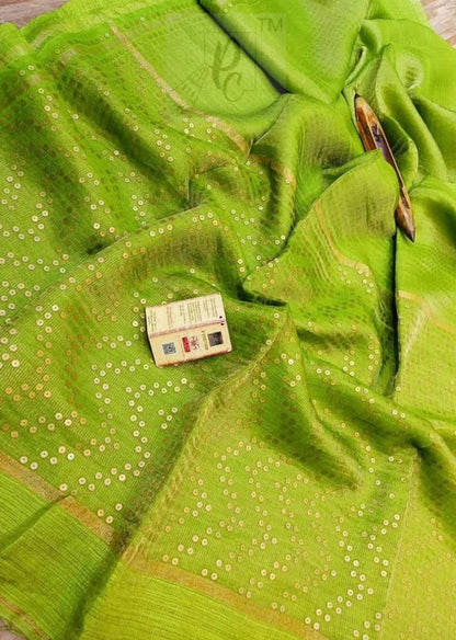 Shama Pure Resham festive saree with dual silver and golden zari stripes, sequin work on palla and border, paired with Pure Matka blouse piece by Rihyaaz.